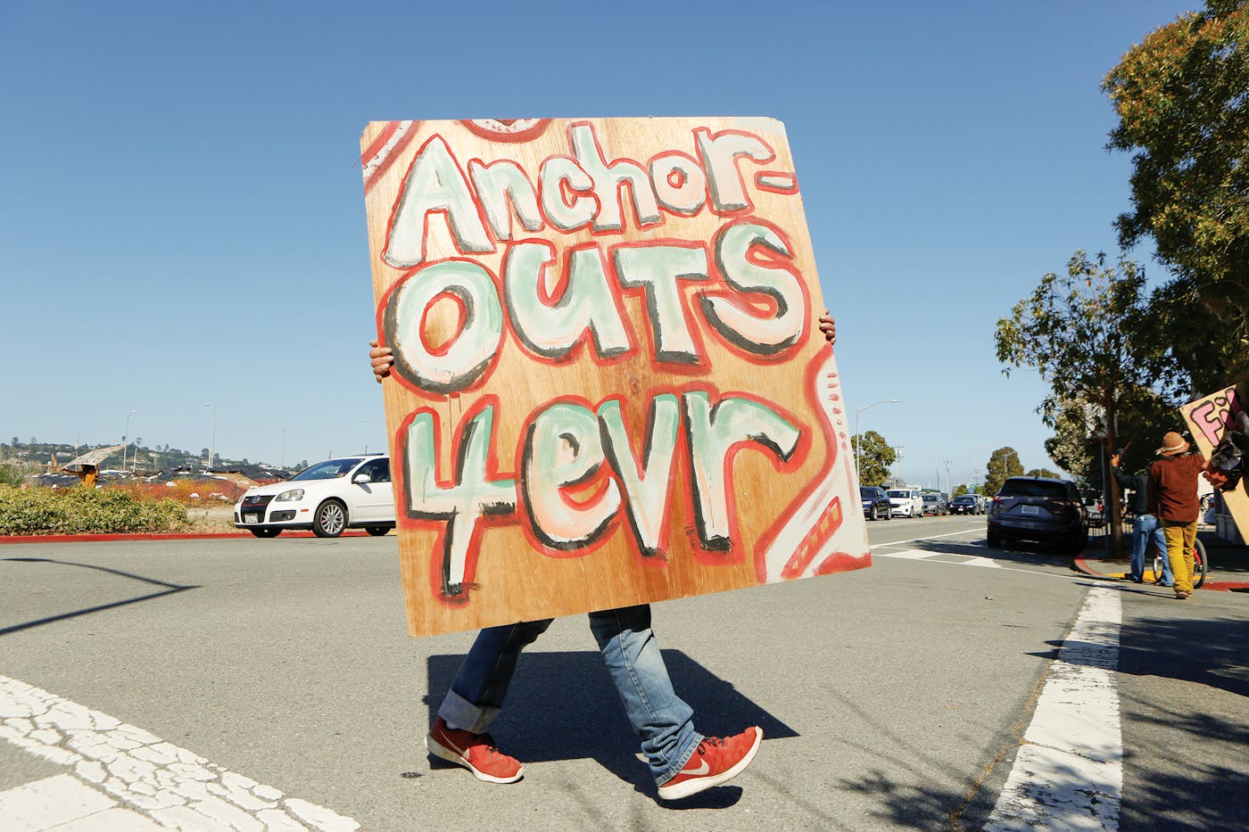Anchor-outs demonstrate against efforts to remove their boats and shut down an onshore encampment
