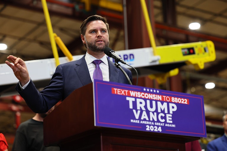 J.D. Vance gestures as he speaks at a campaign event