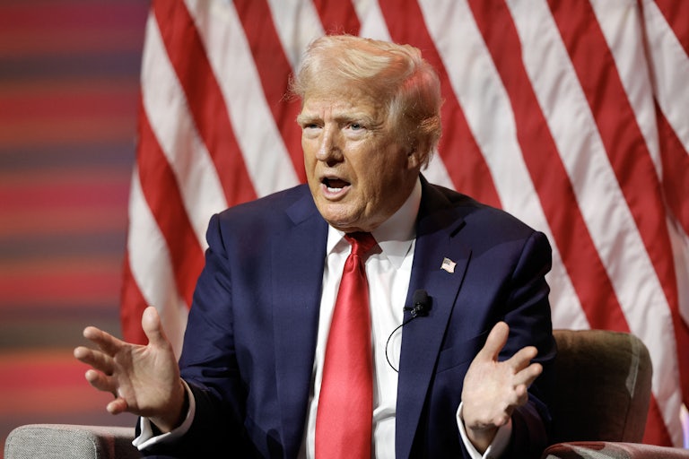 Donald Trump speaks with hands spread