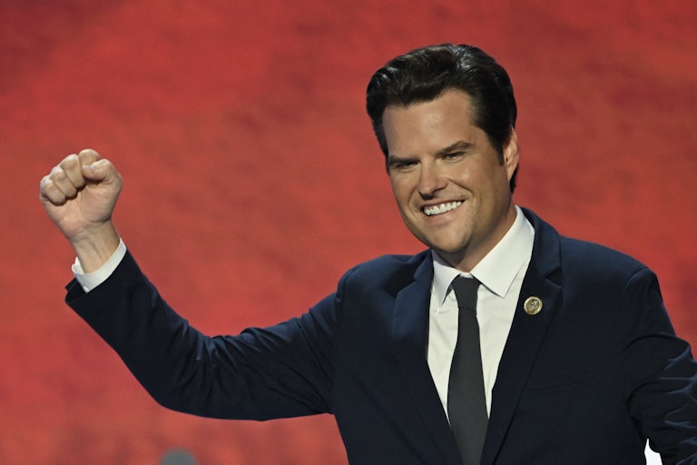 Representative Matt Gaetz at the RNC raises his fist as if in victory