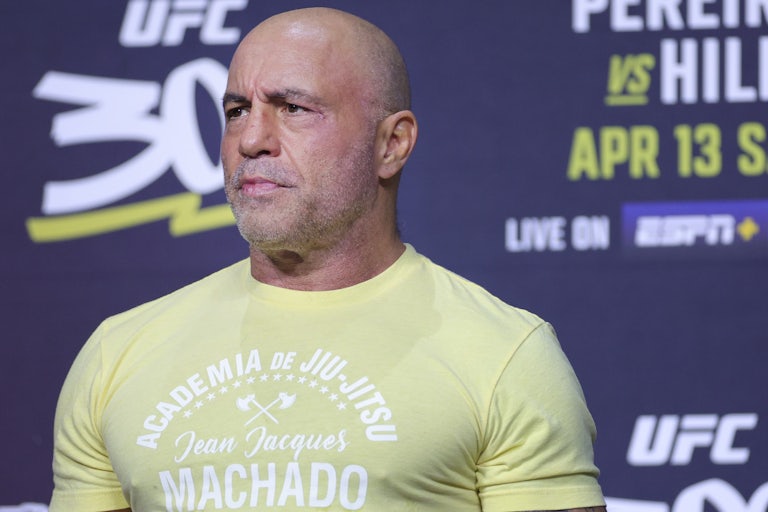 Joe Rogan stands during a UFC weigh-in