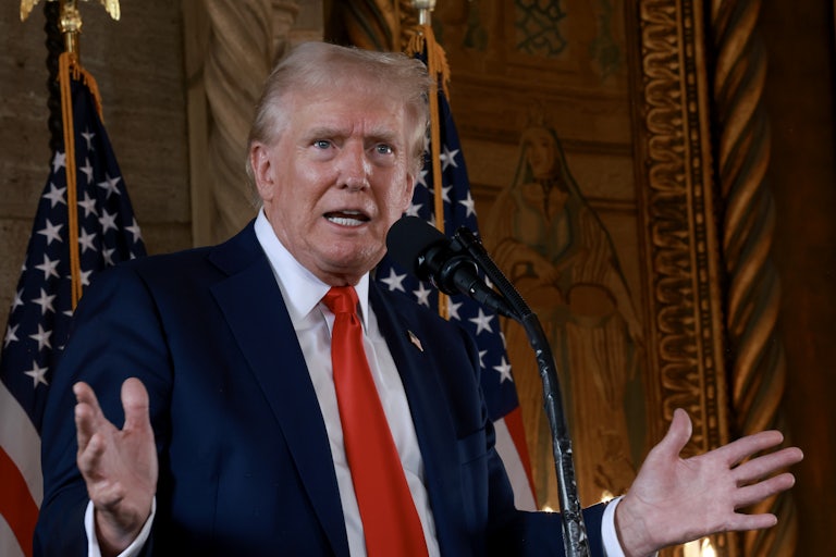 Donald Trump gestures as he speaks during a press conference at Mar-a-Lago