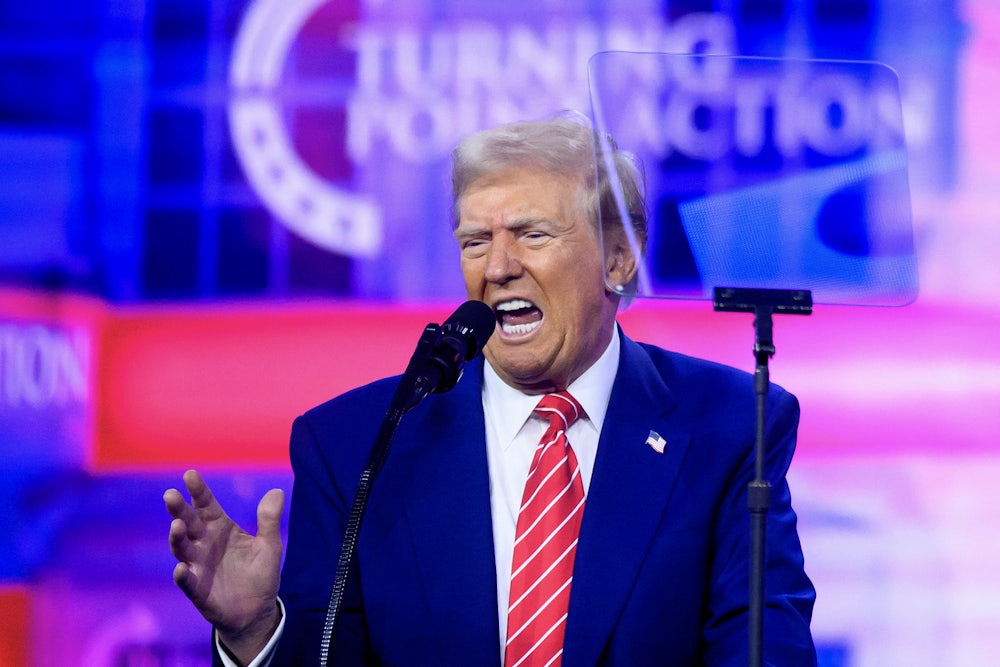 Donald Trump gestures while speaking