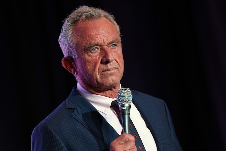 Robert F. Kennedy Jr. holds up a microphone