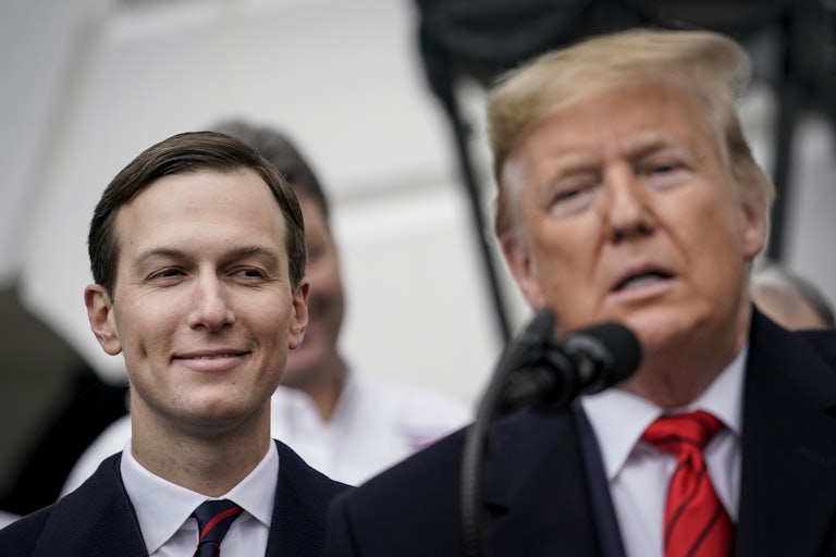 Jared Kushner smiles behind Donald Trump and looks at him creepily while he speaks.