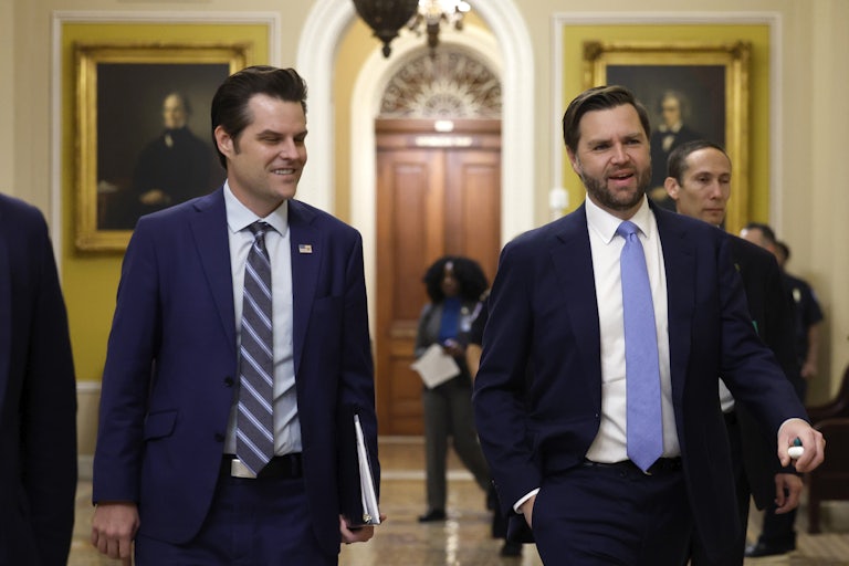 Matt Gaetz smiles while walking with JD Vance in the Senate