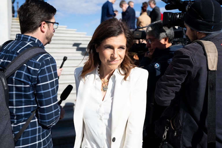 Nancy Mace walks past reporters outside the Capitol