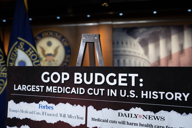A poster at a Democratic press conference warns the Republican Party will cut Medicaid