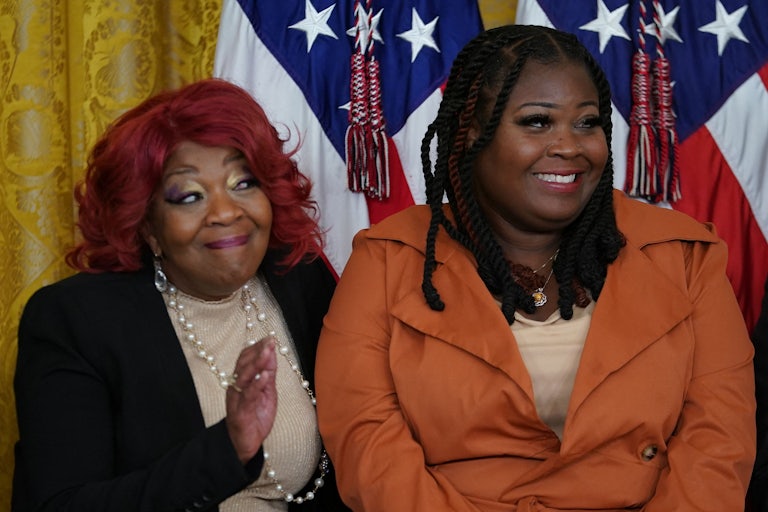 Georgia election workers Ruby Freeman and Shaye Moss smile