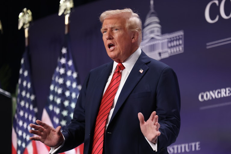 Donald Trump gestures while speaking